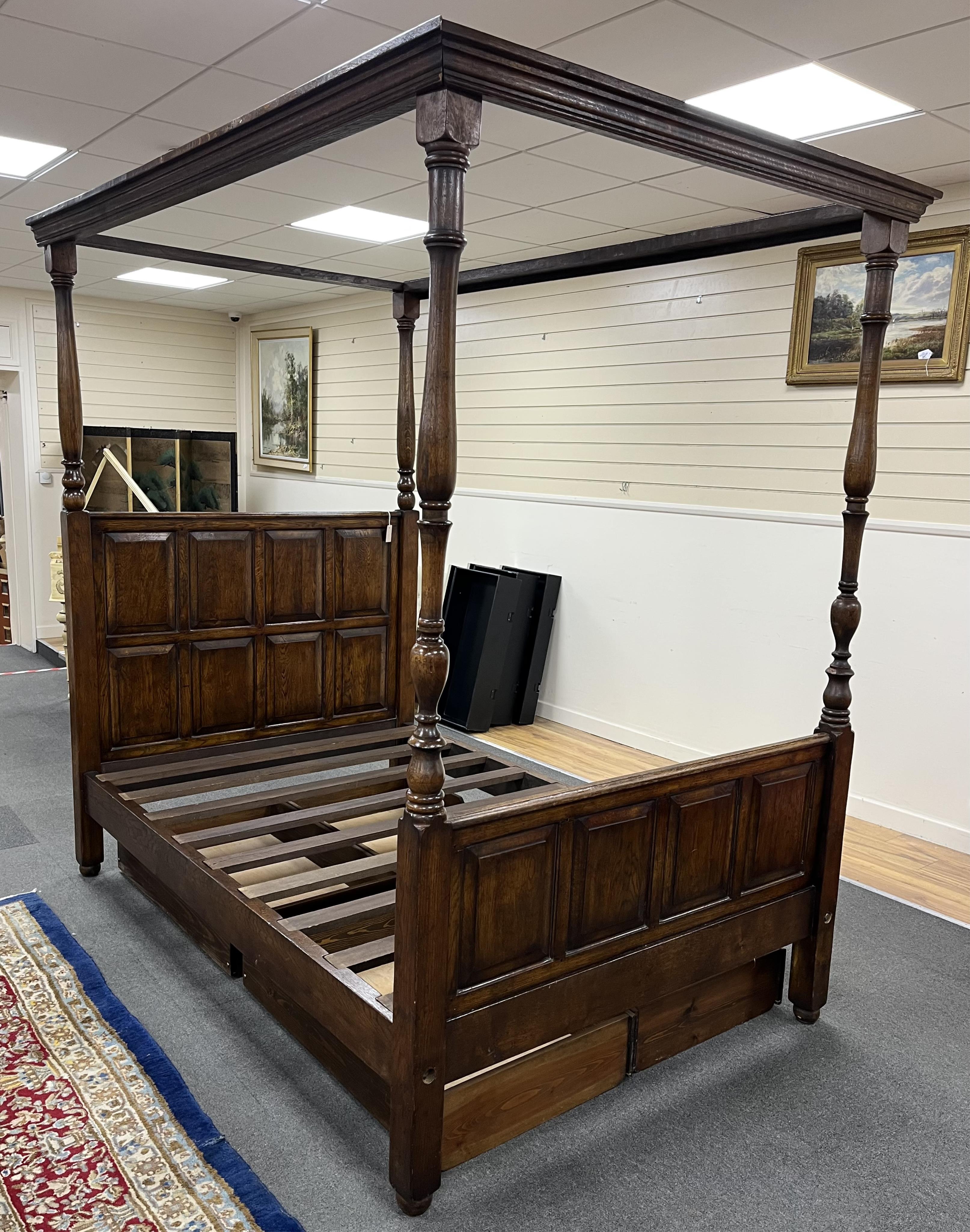 A reproduction 17th century style oak four poster bed frame, width 140cm, length 210cm, height 223cm. Condition - good